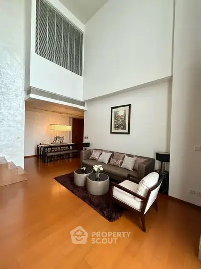 Spacious modern living room with high ceilings and elegant decor