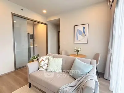 Modern living room with cozy sofa and stylish decor in bright apartment.