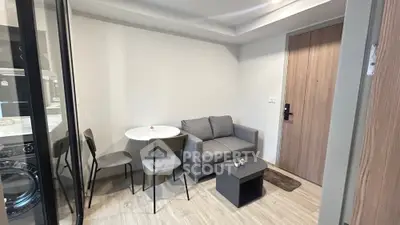 Modern compact living room with cozy sofa and dining area in stylish apartment