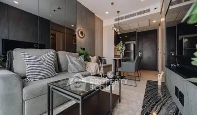 Modern living room with stylish decor and open dining area in a contemporary apartment.