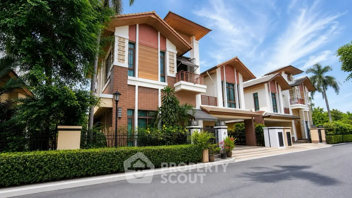 Stunning modern residential building with lush greenery and elegant architecture.