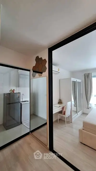 Modern apartment interior with open layout, featuring a cozy living area and stylish kitchen.