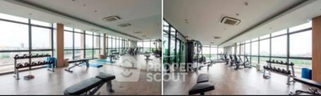 Spacious gym with modern equipment and panoramic city views
