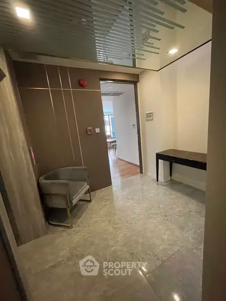 Modern apartment entrance with stylish decor and marble flooring