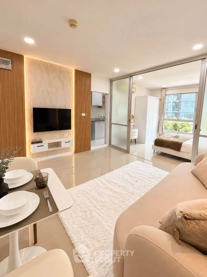 Modern open-plan living room with stylish decor and natural light