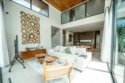 Luxurious modern living room with high ceilings and stylish decor