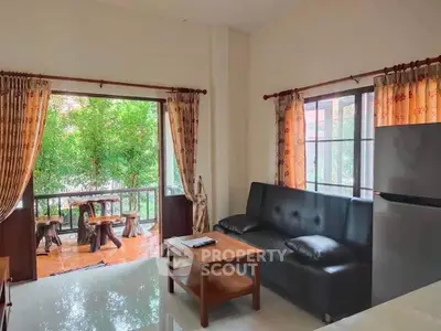 Cozy living room with balcony view and natural light