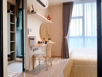 Bright and cozy bedroom with study area, featuring modern decor and natural light.