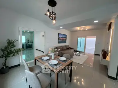 Modern open living room with dining area and stylish decor