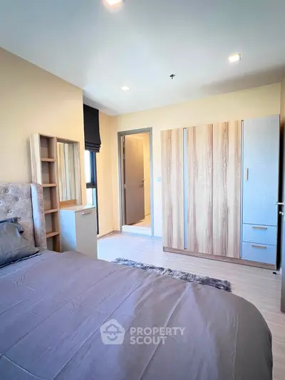 Modern bedroom with stylish furniture and ample natural light