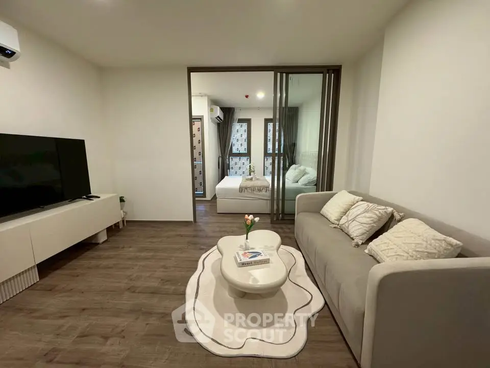Modern living room with cozy sofa and stylish decor in open layout apartment