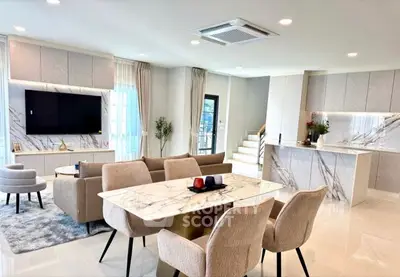 Luxurious modern living room with elegant decor and open layout.