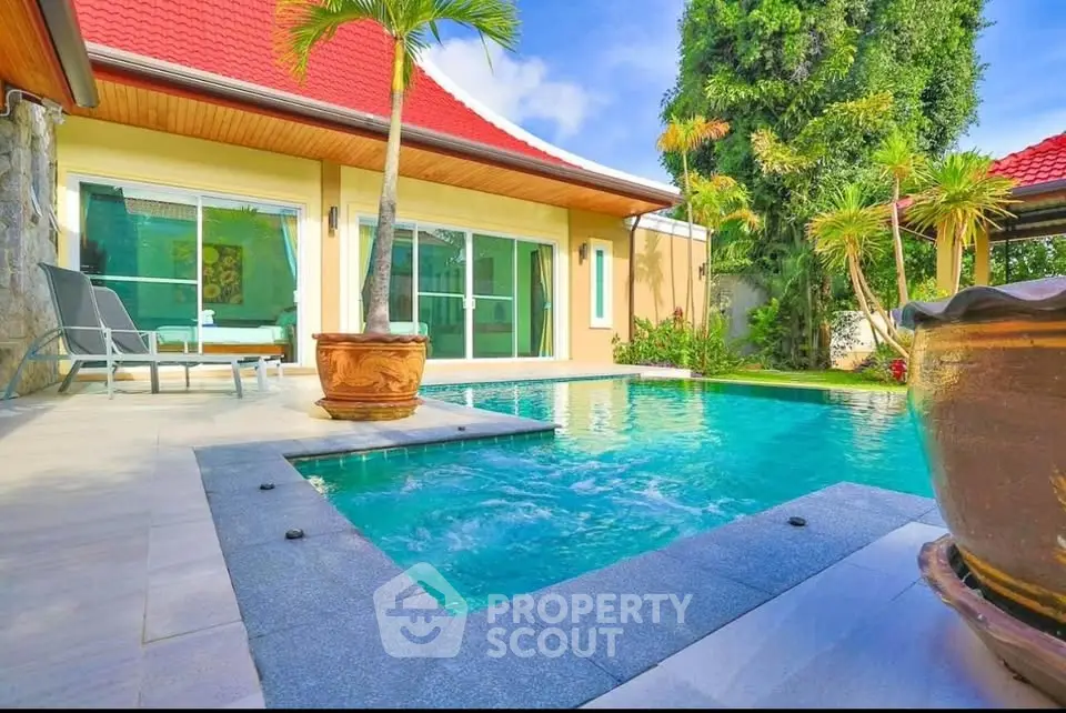 Luxurious villa with private pool and tropical garden, perfect for relaxation and entertainment.