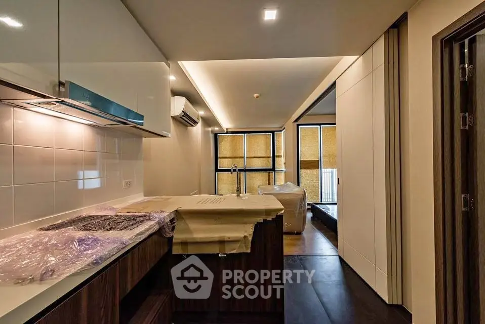 Modern apartment interior with sleek kitchen and spacious living area