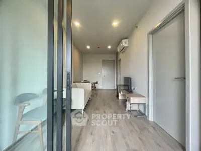 Modern living room with sleek furniture and wooden flooring