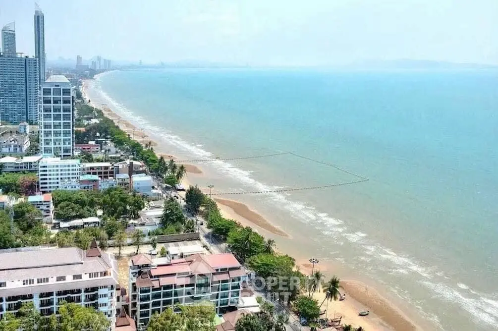 Stunning beachfront view with high-rise buildings and serene coastline.
