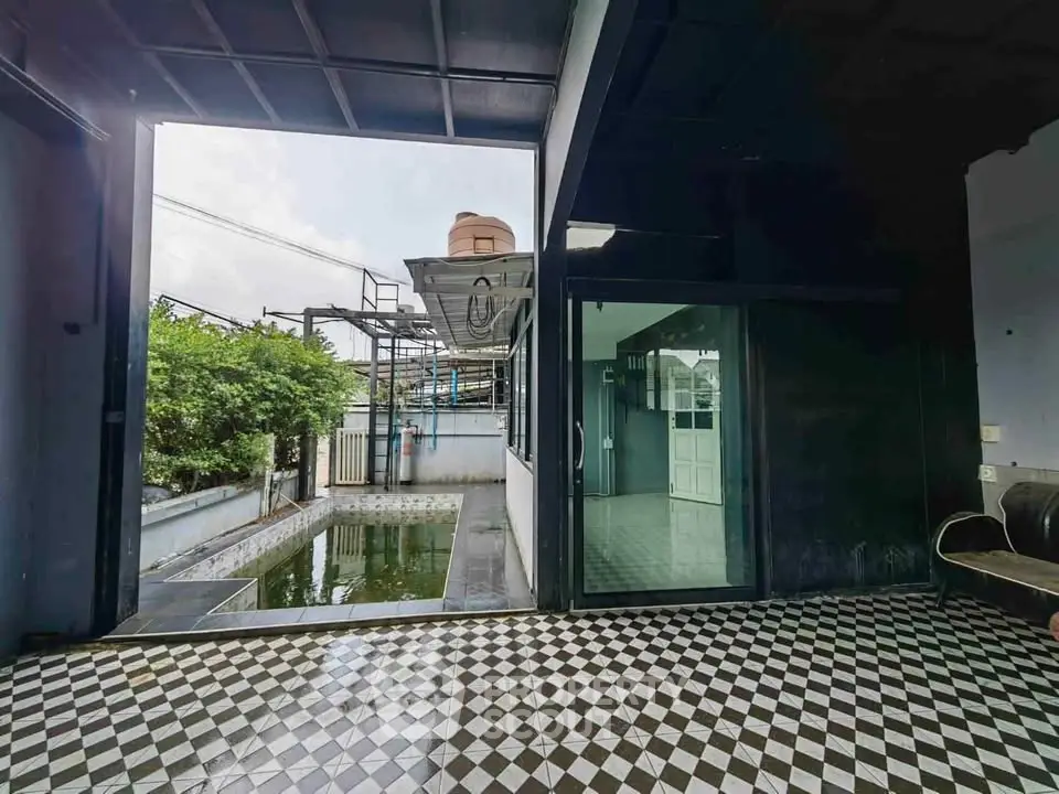 Spacious industrial-style property with open layout and private pool, ideal for modern living.