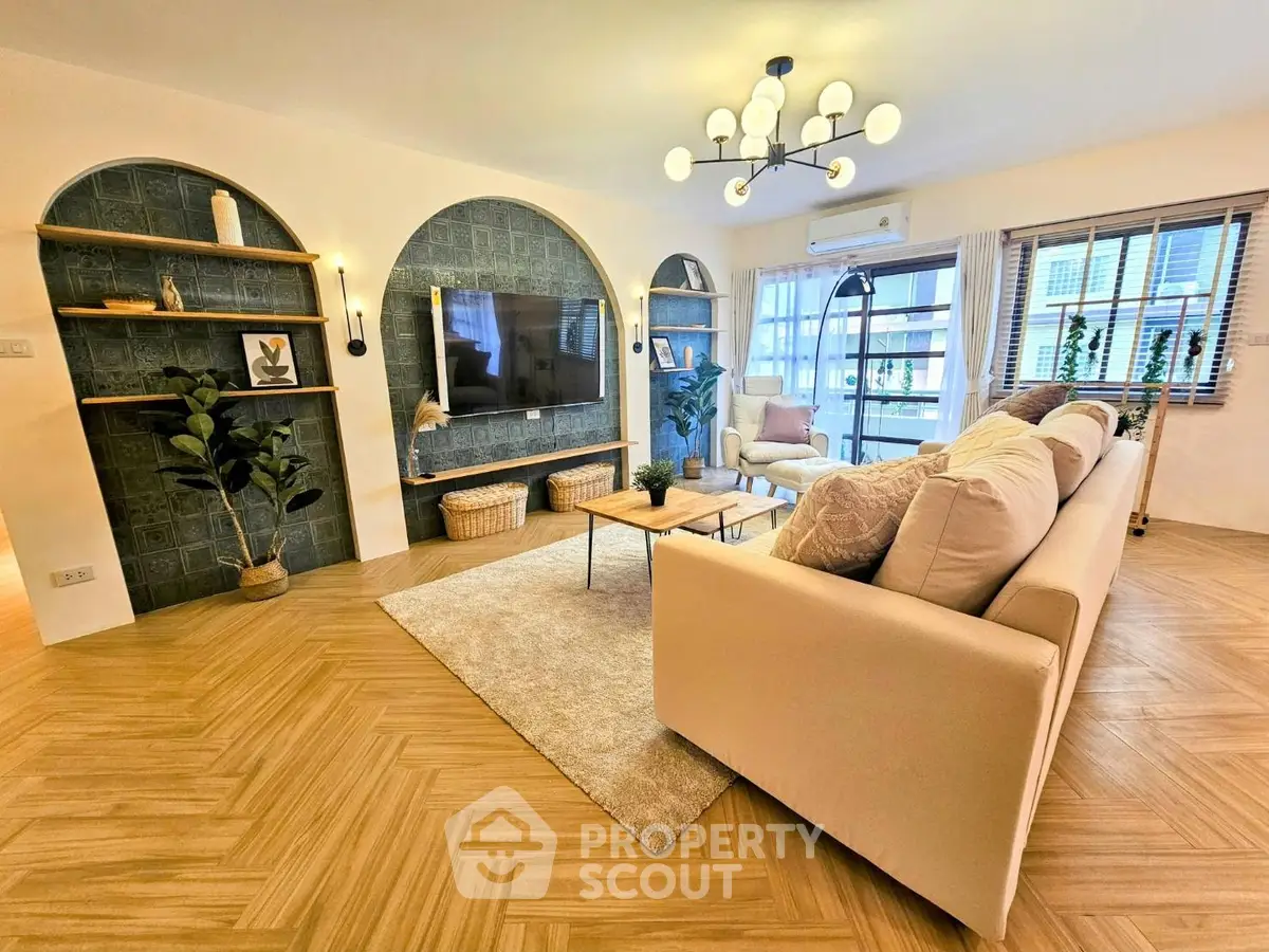 Spacious modern living room with elegant decor and large windows