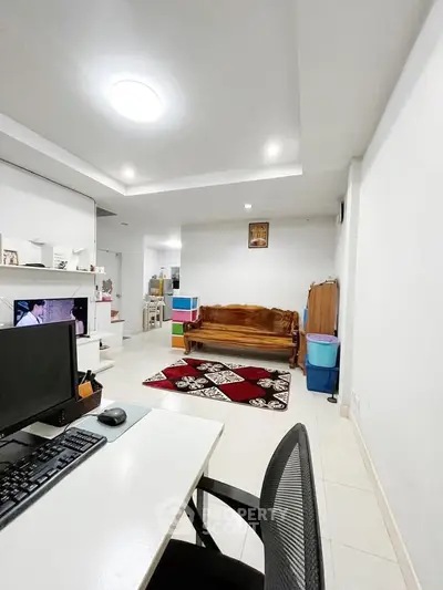 Spacious living room with modern decor and cozy seating area