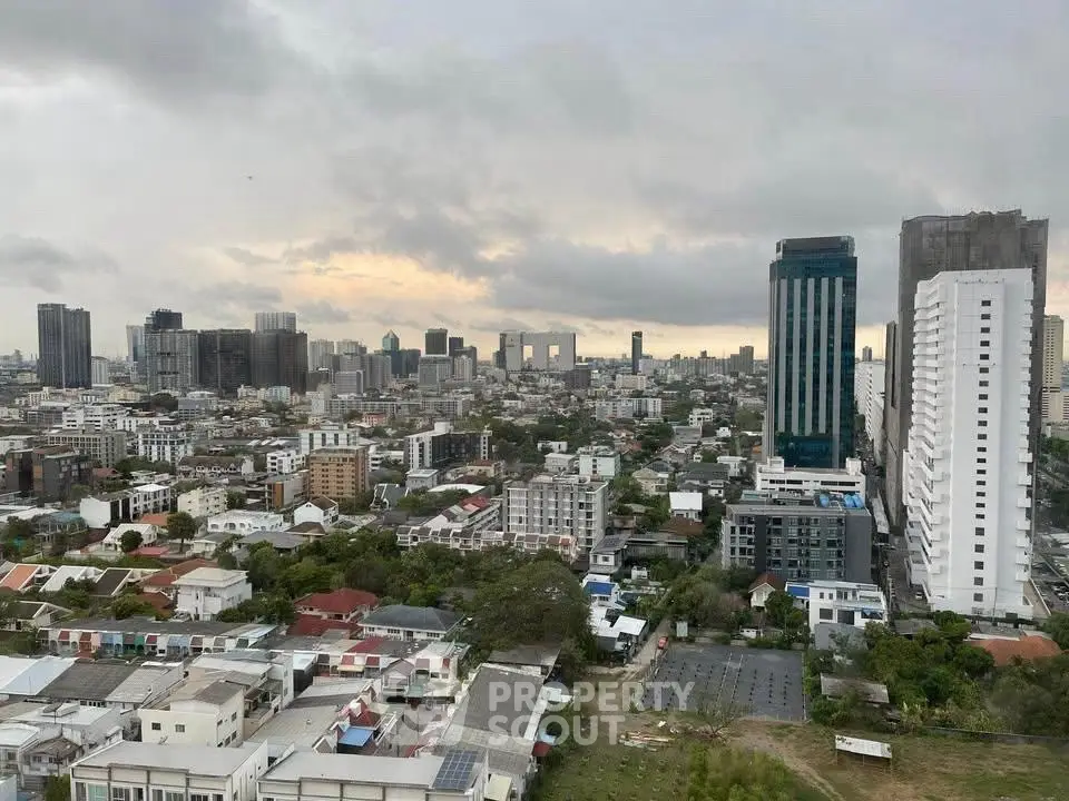 Stunning cityscape view showcasing urban skyline and residential buildings at dusk.