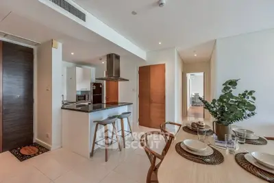 Modern open-plan kitchen and dining area with stylish decor and natural light.