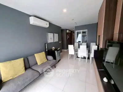 Modern living room with sleek furniture and air conditioning in a stylish apartment.