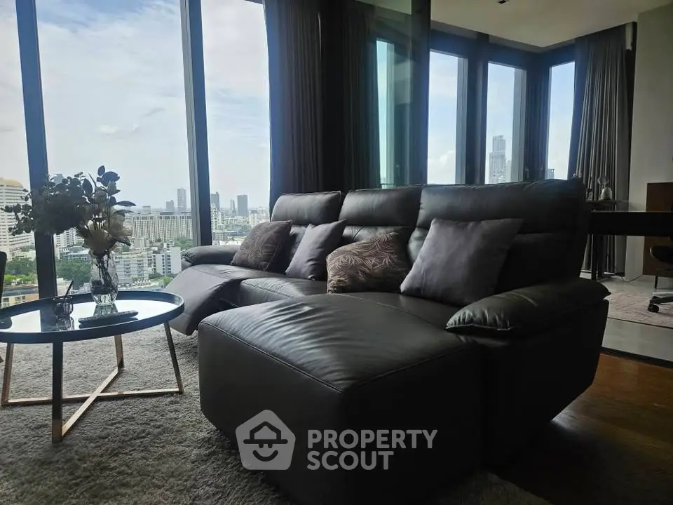 Luxurious living room with panoramic city view and modern leather sofa