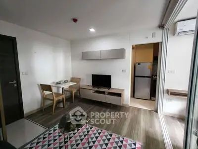 Modern living room with stylish furniture and open kitchen layout