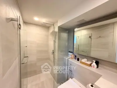 Modern bathroom with glass shower and sleek design