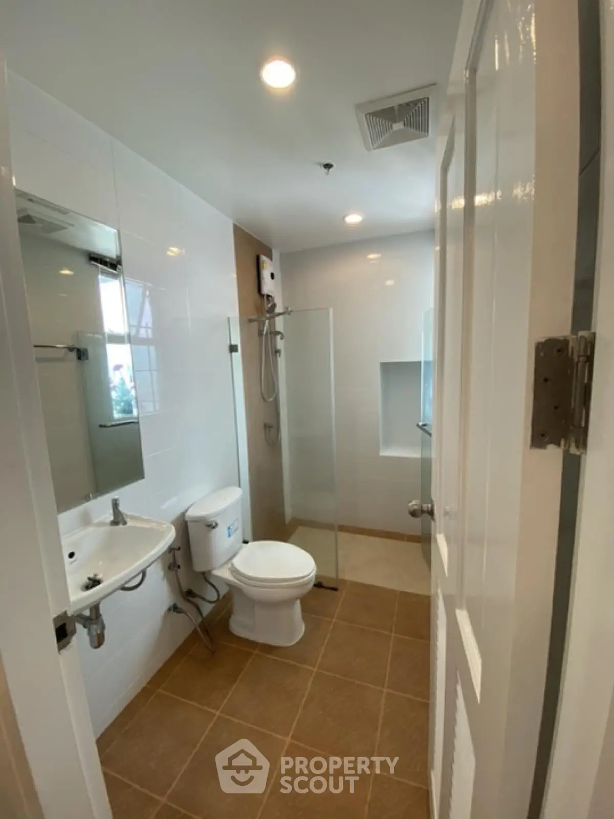 Modern bathroom with sleek fixtures and glass shower enclosure