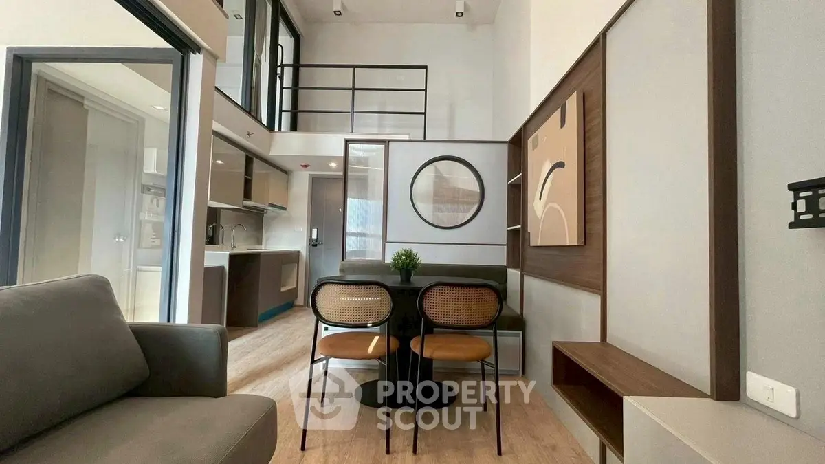 Modern loft-style living room with open kitchen and stylish decor