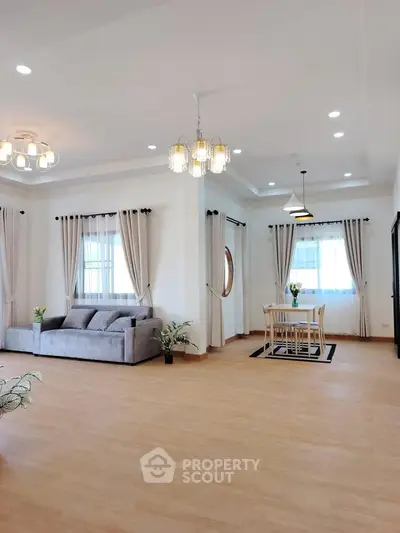 Spacious modern living room with elegant decor and dining area