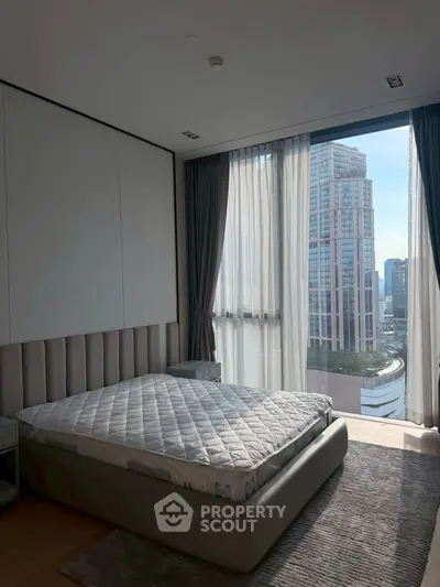 Luxurious bedroom with stunning city view and modern decor