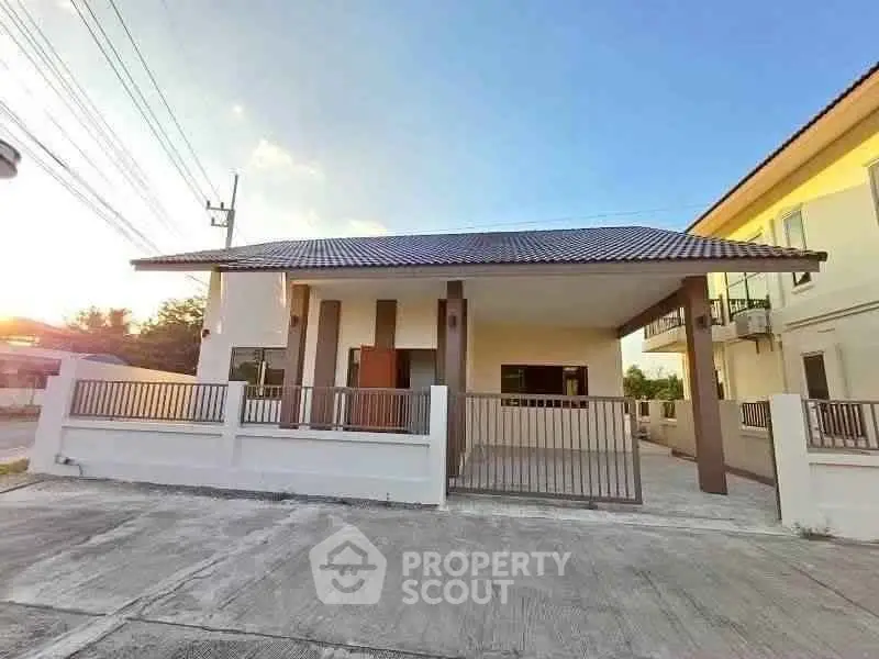 Charming single-story house with spacious driveway and modern design in a serene neighborhood.