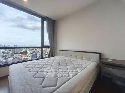 Spacious bedroom with stunning city view and modern furnishings