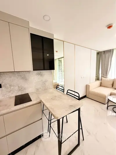 Modern kitchen with sleek design and open layout in a stylish apartment