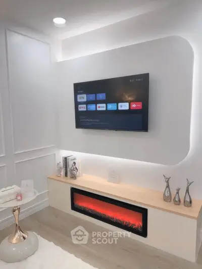 Modern living room with wall-mounted TV and electric fireplace