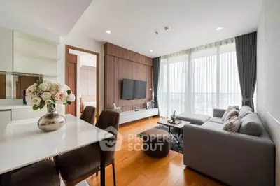 Modern living room with elegant decor and large windows offering stunning views.