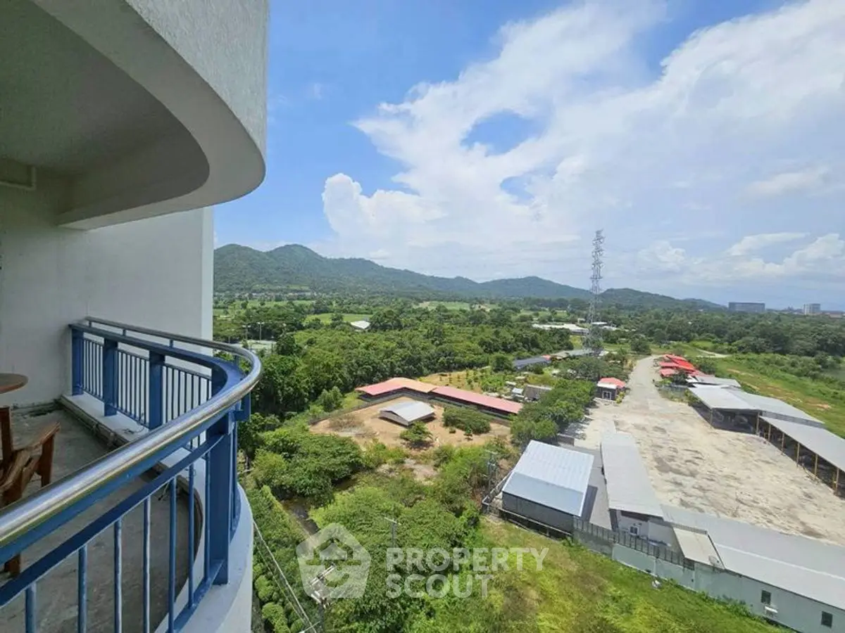 Stunning balcony view of lush greenery and distant mountains