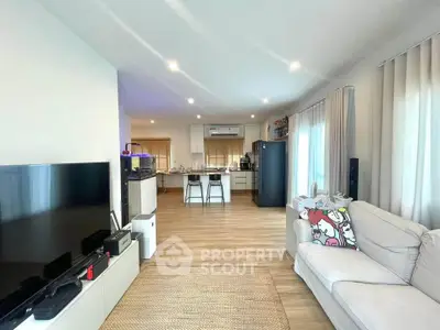 Spacious modern living room with open kitchen and stylish decor