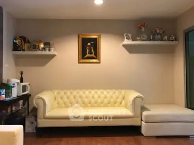 Cozy living room with elegant white sofa and decorative shelves