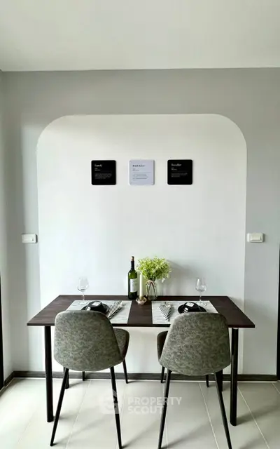 Modern dining area with stylish table and chairs, perfect for cozy meals and gatherings.