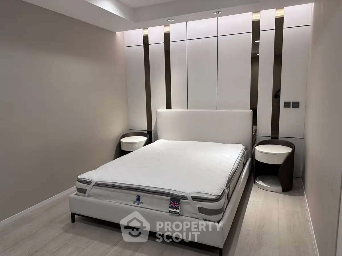 Modern bedroom with sleek design and elegant furnishings, featuring a comfortable bed and stylish nightstands.