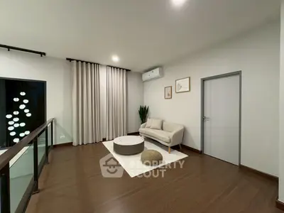 Modern living room with elegant decor and cozy seating area