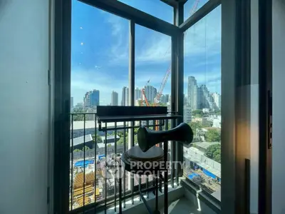 Stunning city view from a modern balcony with construction in progress, perfect urban living.