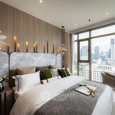Luxurious bedroom with city view, modern decor, and elegant lighting in high-rise apartment.