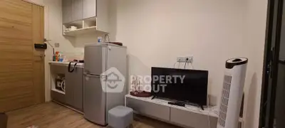 Cozy apartment interior with compact kitchen and modern appliances