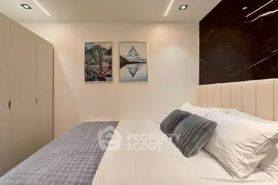 Modern bedroom with elegant decor and cozy bedding