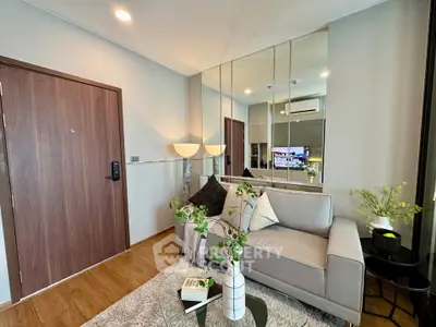 Modern living room with stylish decor and mirrored wall