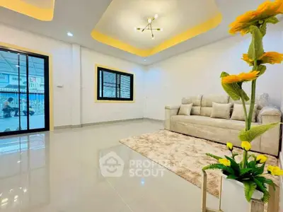 Modern living room with elegant lighting and plush sofa, featuring a bright and spacious design.